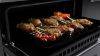 Rangemaster 15828 Edge Deluxe 110cm Dual Fuel Range Cooker in Black Glass with Chrome Trim - EDDLB110DFGBLK/CM1_oven