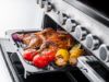 Rangemaster 15816 Edge Deluxe 110 Dual Fuel Range Cooker in Black Glass with Chrome Trim - EDDLO110DFGBLK/CM1_grill